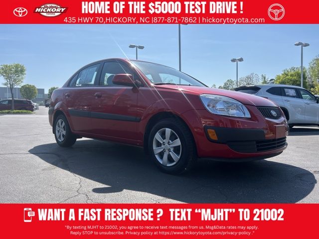 Tropical Red 2009 Kia Rio LX Sedan Front-Wheel Drive 4-Speed Automatic Overdrive