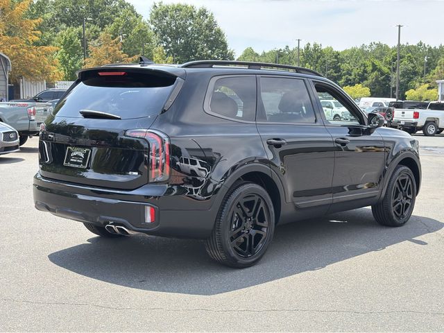 Used 2025 Black Kia EX X-Line image 13