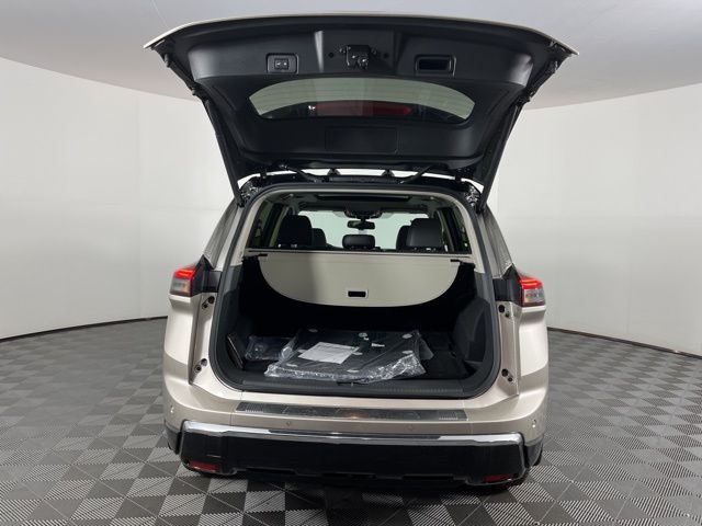 2025 Champagne Silver Metallic/Super Black Nissan Rogue Platinum FWD SUV