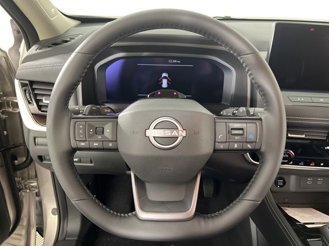 2025 Champagne Silver Metallic/Super Black Nissan Rogue Platinum FWD SUV