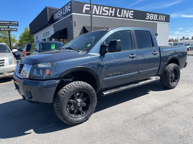 Blue 2014 Nissan Titan Pickup Truck Four-Wheel Drive 5-Speed Automatic