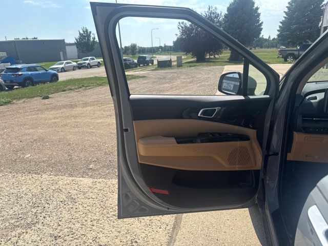 2024 Ceramic Silver Kia Carnival EX FWD Van