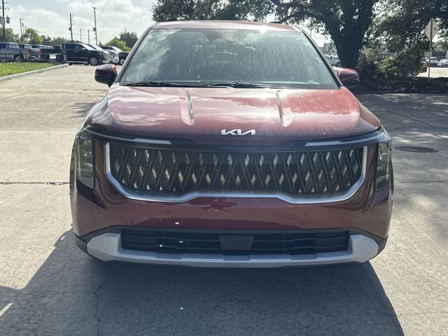 2025 Kia Carnival LXS Red at Bayshore Chrysler Jeep Dodge Ram