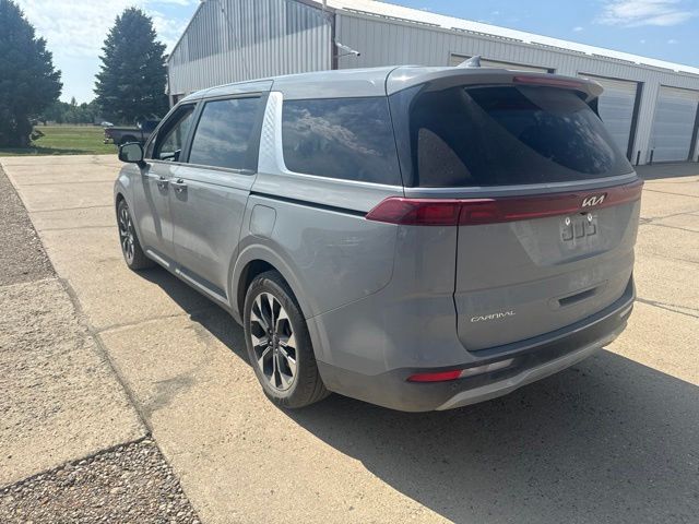2024 Ceramic Silver Kia Carnival EX FWD Van