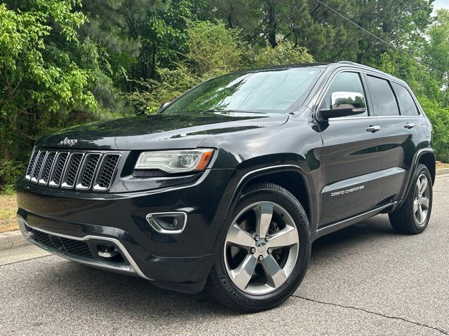 Brilliant Black Crystal Pearlcoat 2014 Jeep Grand Cherokee Overland 4WD SUV / Crossover Four-Wheel Drive 8-Speed Automatic
