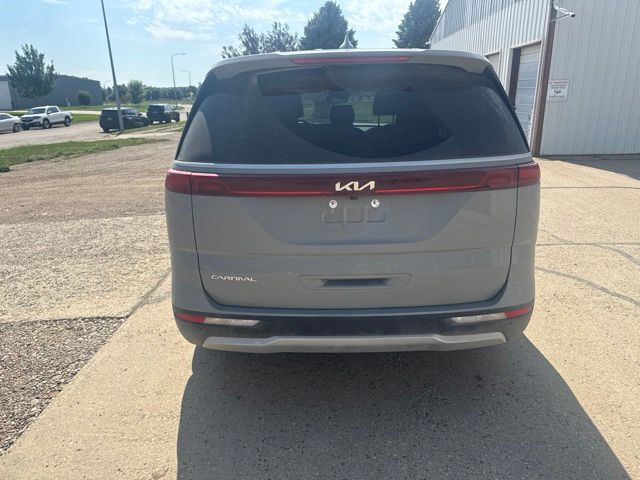 2024 Ceramic Silver Kia Carnival EX FWD Van
