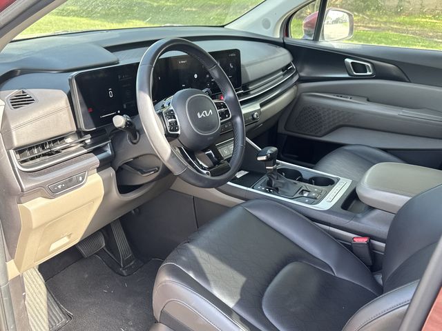 2025 Kia Carnival LXS Red at Bayshore Chrysler Jeep Dodge Ram