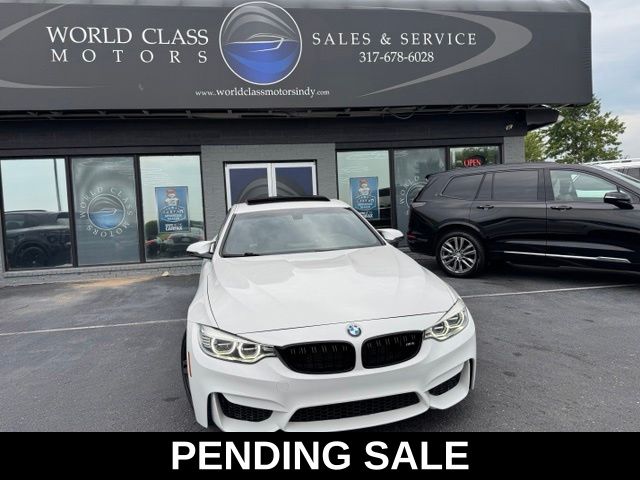 Alpine White 2015 BMW M4 Coupe Rear-Wheel Drive 6-Speed Manual