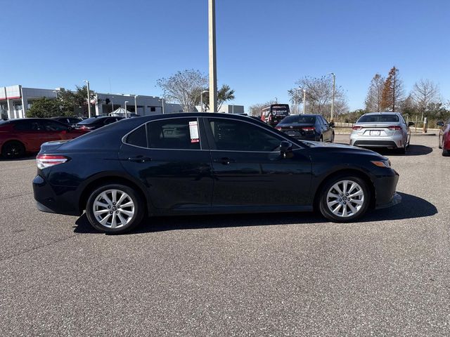 Used 2019 Toyota Camry LE with VIN 4T1B11HK3KU713516 for sale in Haines City, FL
