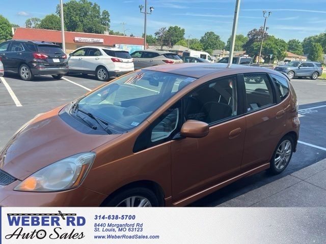 Orange 2009 Honda Fit Sport Hatchback Front-Wheel Drive 5-Speed Manual