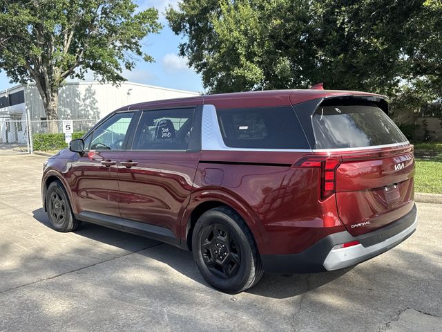 2025 Kia Carnival LXS Red at Bayshore Chrysler Jeep Dodge Ram