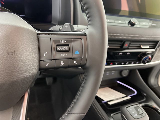 2025 Champagne Silver Metallic/Super Black Nissan Rogue Platinum FWD SUV