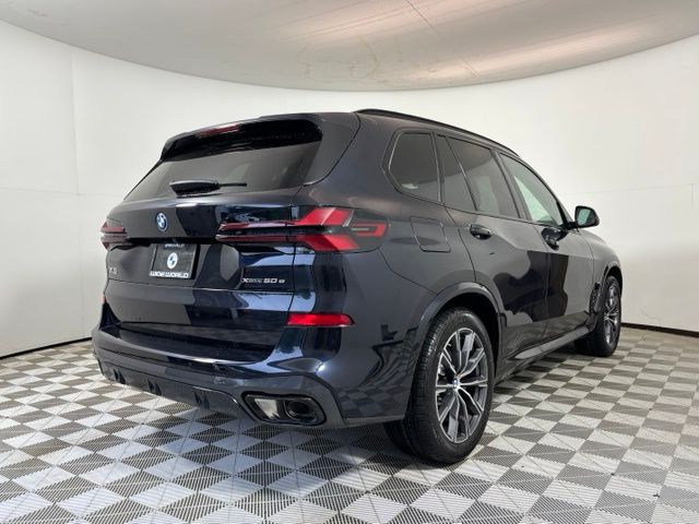 New 2026 Black BMW xDrive50e image 7
