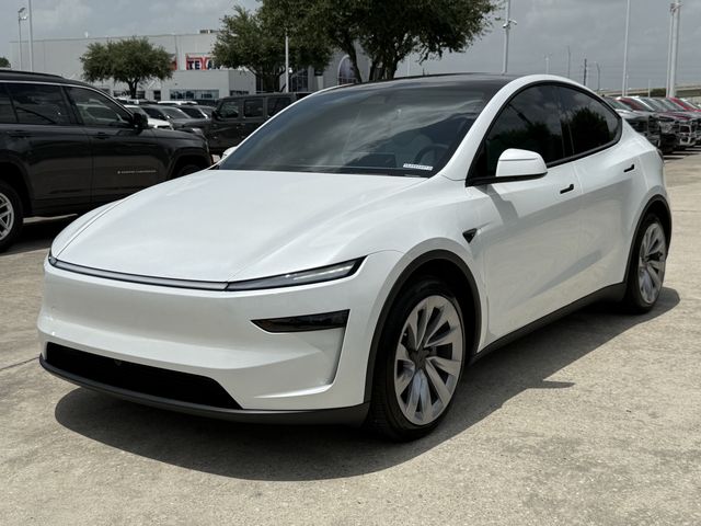 2026 Tesla Model Y Long Range White at AutoSavvy Houston Northwest