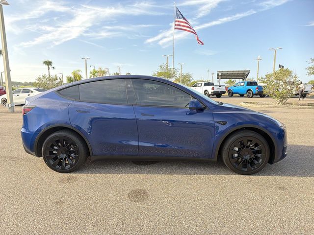 Used 2024 Tesla Model Y Long Range with VIN 7SAYGAEE7RF167305 for sale in Haines City, FL