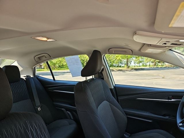 2025 Toyota Camry LE White at Classic Elite Chevrolet Sugar Land