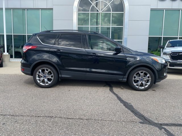 2015 Ford Escape SE - Tuxedo Black exterior view 4