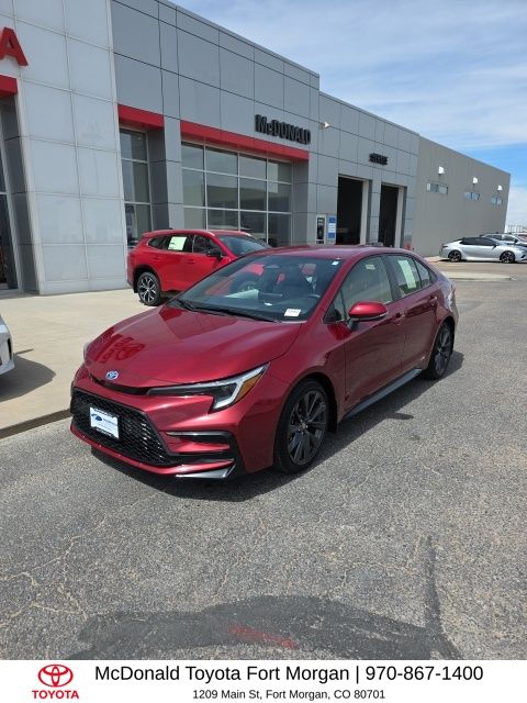 Red (Ruby Flare Pearl) 2025 Toyota Corolla Hybrid SE AWD Sedan All-Wheel Drive Continuously Variable Transmission