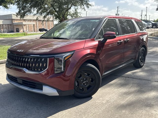 2025 Kia Carnival LXS Red at Shottenkirk Kia Fort Bend