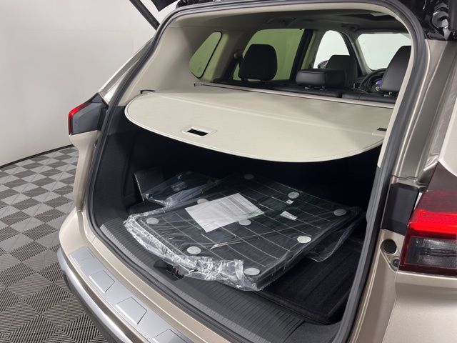2025 Champagne Silver Metallic/Super Black Nissan Rogue Platinum FWD SUV