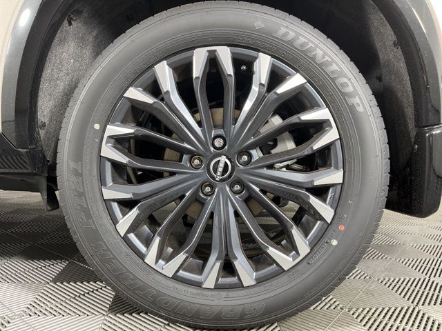 2025 Champagne Silver Metallic/Super Black Nissan Rogue Platinum FWD SUV