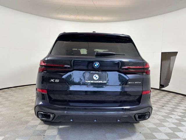 New 2026 Black BMW xDrive50e image 6