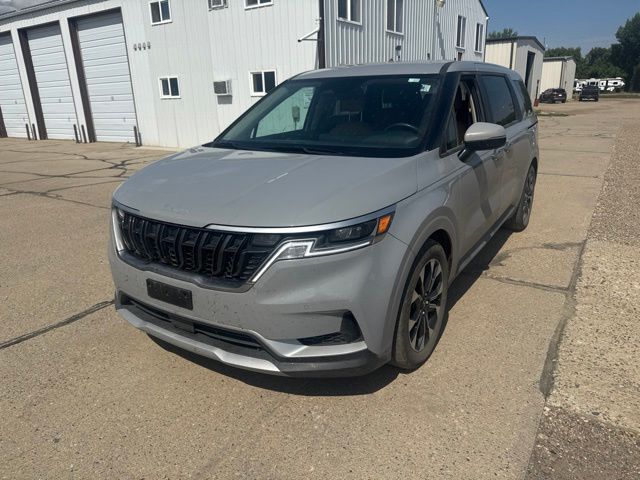 2024 Ceramic Silver Kia Carnival EX FWD Van