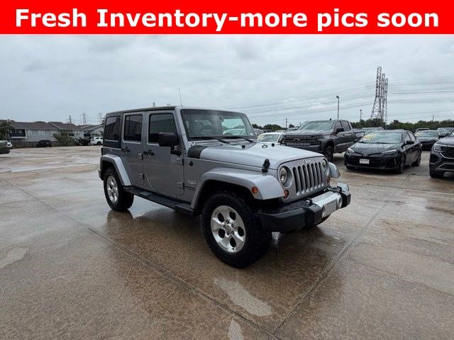 2013 Jeep Wrangler Unlimited Sahara Silver at DeMontrond Auto Country