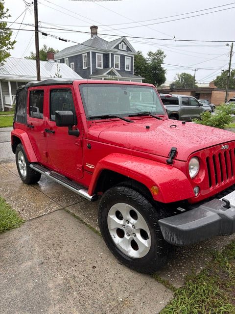 Used 2014 Red Jeep Unlimited Sahara image 28