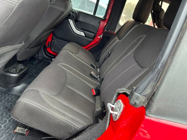 Used 2014 Red Jeep Unlimited Sahara image 17