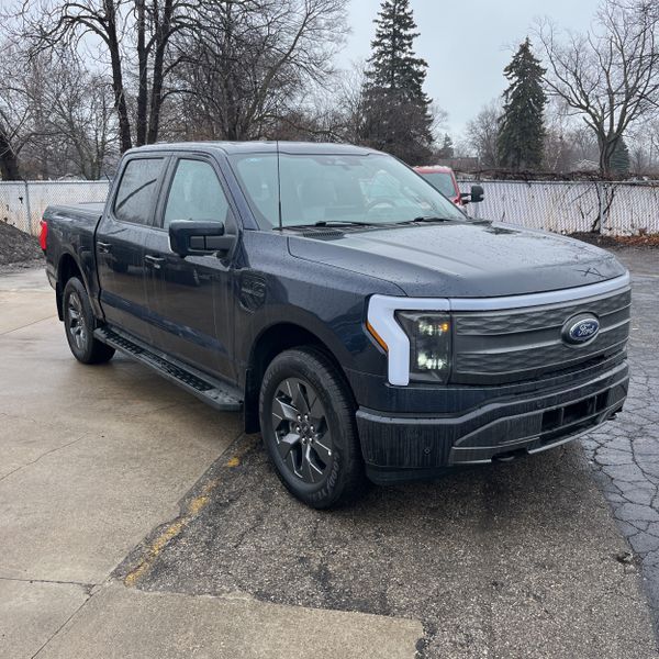 Antimatter Blue Metallic 2023 Ford F-150 Lightning Lariat SuperCrew AWD Pickup Truck All-Wheel Drive Automatic