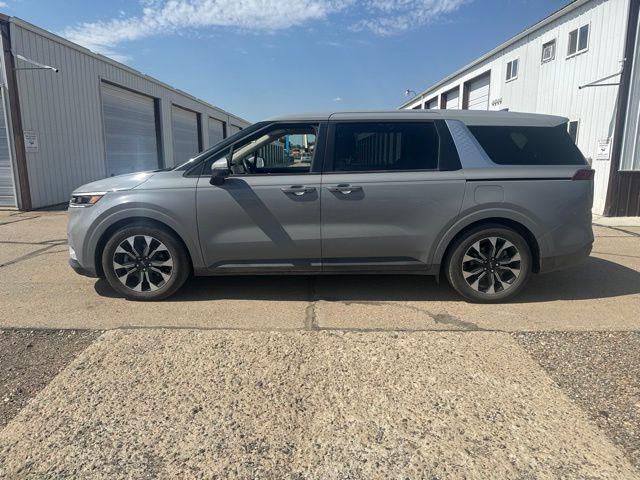 2024 Ceramic Silver Kia Carnival EX FWD Van