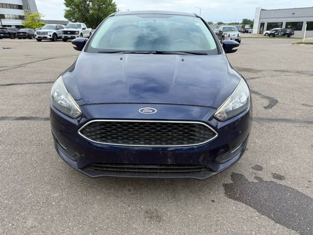 2016 Blue Ford Focus SE FWD Sedan
