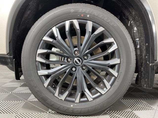 2025 Champagne Silver Metallic/Super Black Nissan Rogue Platinum FWD SUV