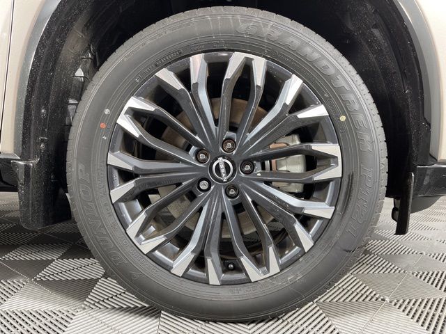 2025 Champagne Silver Metallic/Super Black Nissan Rogue Platinum FWD SUV