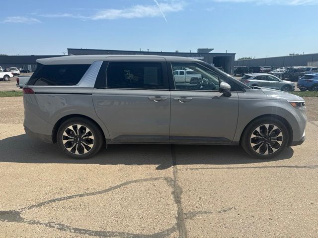 2024 Ceramic Silver Kia Carnival EX FWD Van