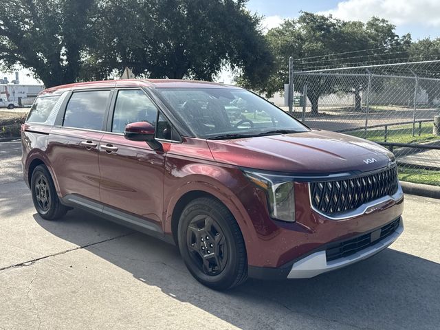 2025 Kia Carnival LXS Red at Bayshore Chrysler Jeep Dodge Ram
