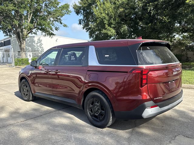 2025 Kia Carnival LXS Red at Shottenkirk Kia Fort Bend