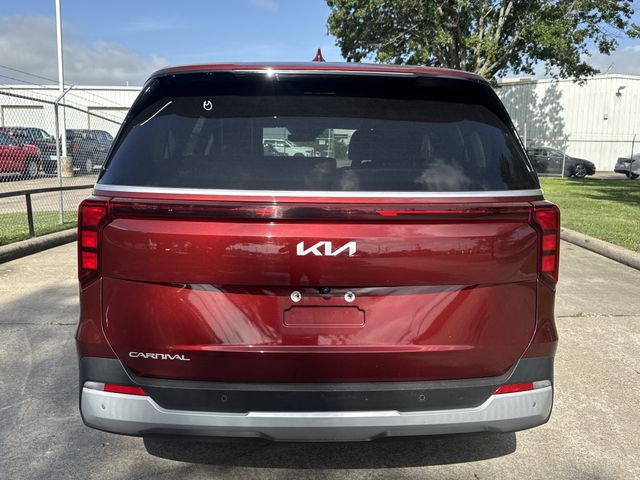 2025 Kia Carnival LXS Red at Bayshore Chrysler Jeep Dodge Ram
