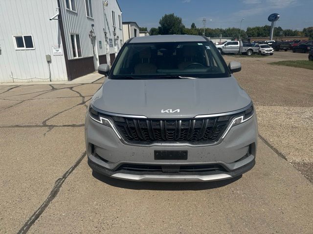 2024 Ceramic Silver Kia Carnival EX FWD Van
