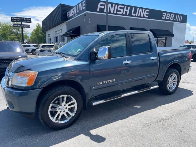 Blue 2013 Nissan Titan Pickup Truck Four-Wheel Drive 5-Speed Automatic