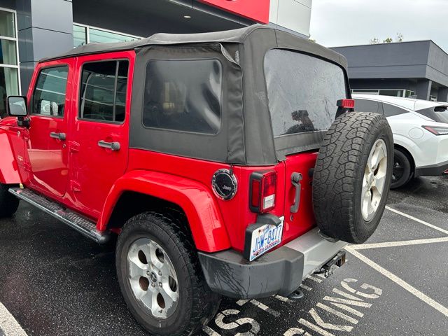 Used 2014 Red Jeep Unlimited Sahara image 6