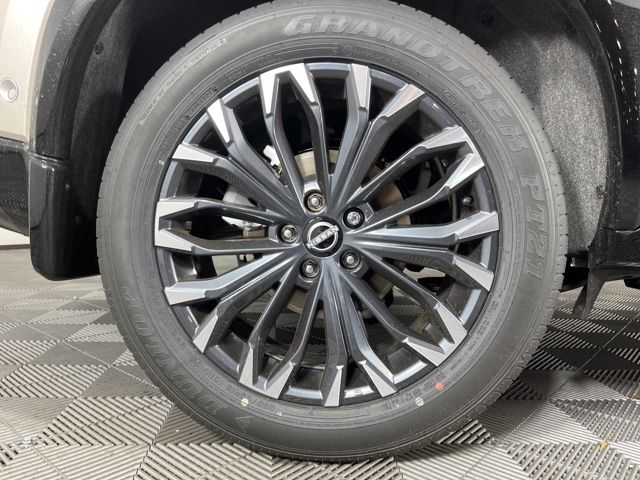 2025 Champagne Silver Metallic/Super Black Nissan Rogue Platinum FWD SUV