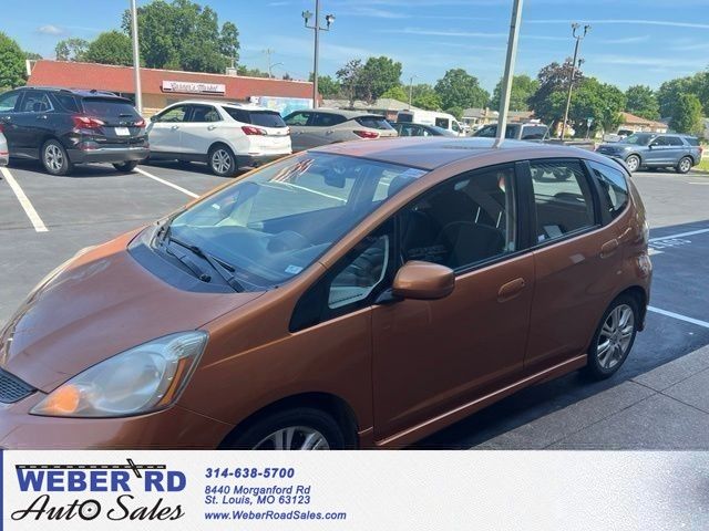 Orange 2009 Honda Fit Sport Hatchback Front-Wheel Drive 5-Speed Manual