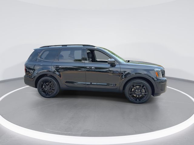 Used 2025 Black Kia EX X-Line image 2