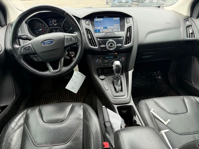 2016 Blue Ford Focus SE FWD Sedan