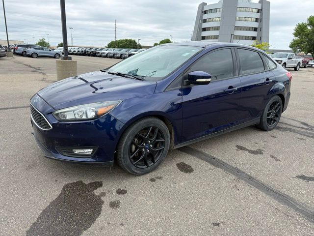 2016 Blue Ford Focus SE FWD Sedan
