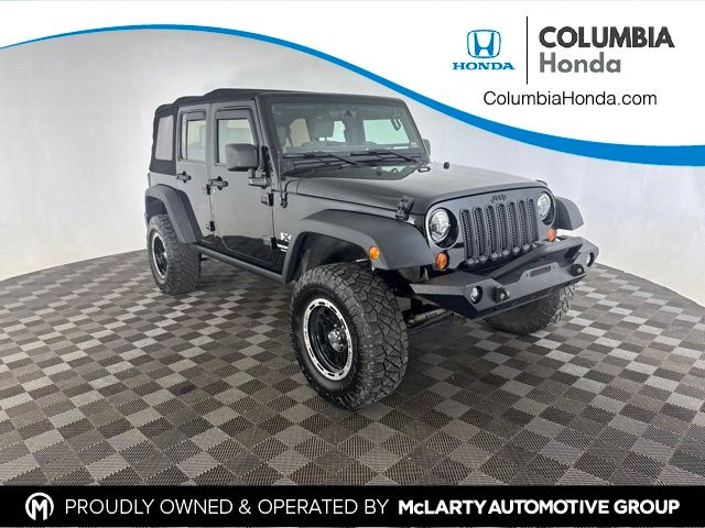 Black Clearcoat/Black Soft Top 2009 Jeep Wrangler SUV / Crossover Four-Wheel Drive 6-Speed Manual
