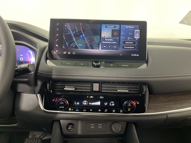 2025 Champagne Silver Metallic/Super Black Nissan Rogue Platinum FWD SUV