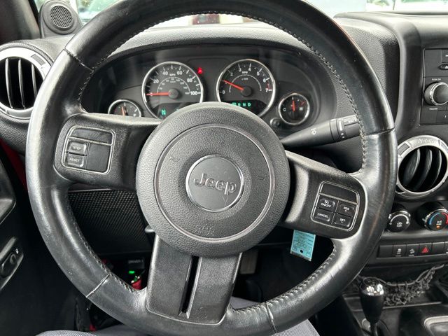 Used 2014 Red Jeep Unlimited Sahara image 25